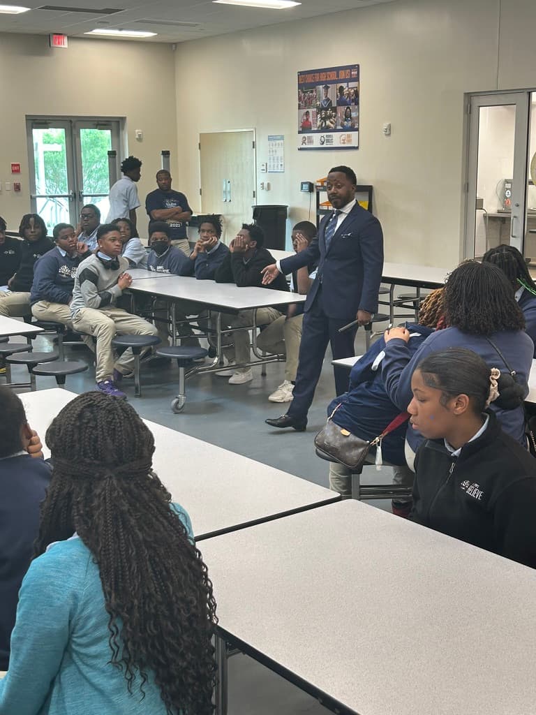 Kenn Barnes speaking with students